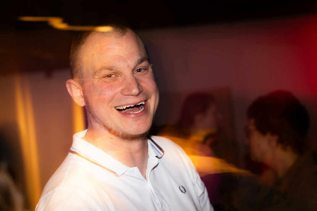 host smiling at event