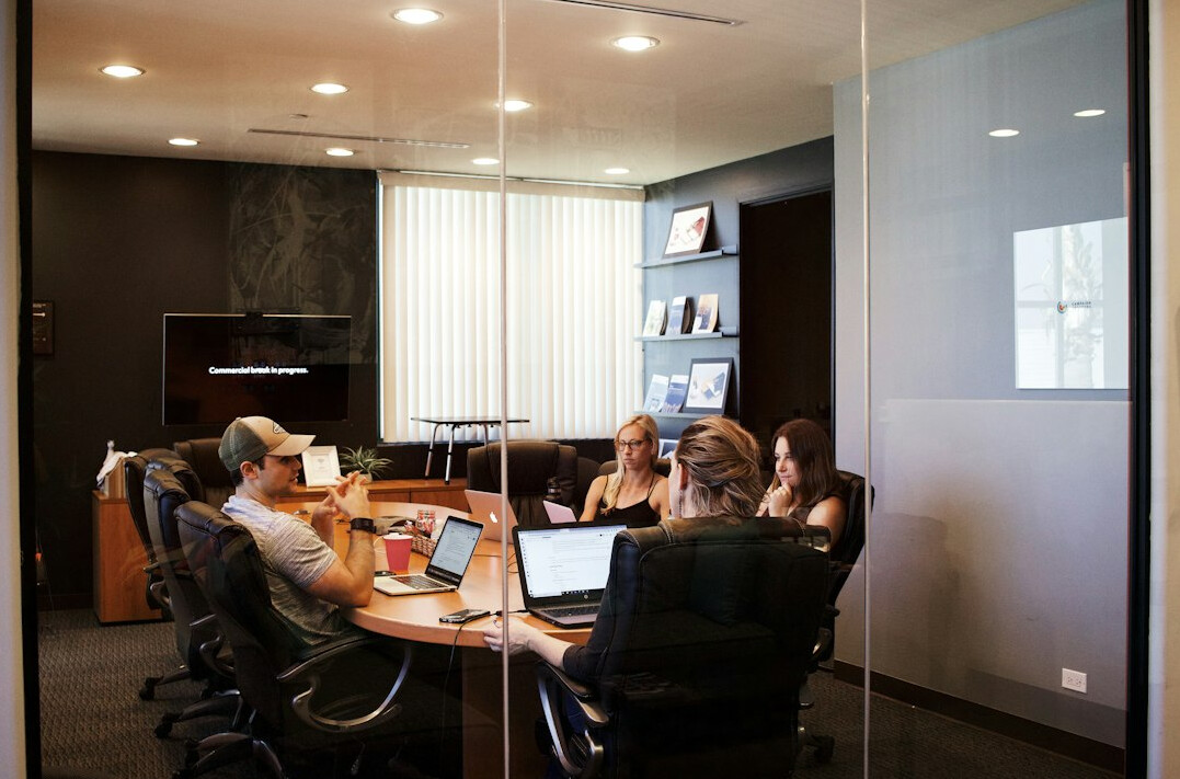 team meeting discussing solutions